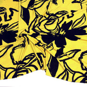 Tissu jersey de viscose jaune aux grandes fleurs noires - COLLECTION ETHNIQUE - tissuspipi.com