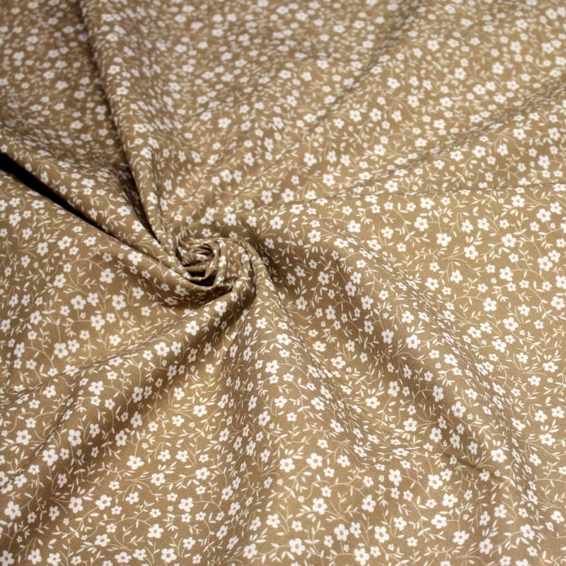 Tissu cotonnade ocre aux fleurs blanches - OEKO - TEX - tissuspipi.com
