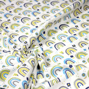 Tissu popeline coton blanc aux arcs en ciel verts bleus et jaunes - tissuspipi.com