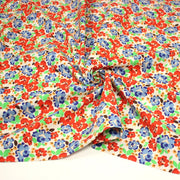 Tissu cotonnade aux fleurs graphiques rouges, bleues, vertes, fond écru - OEKO - TEX STANDARD 100 - tissuspipi.com