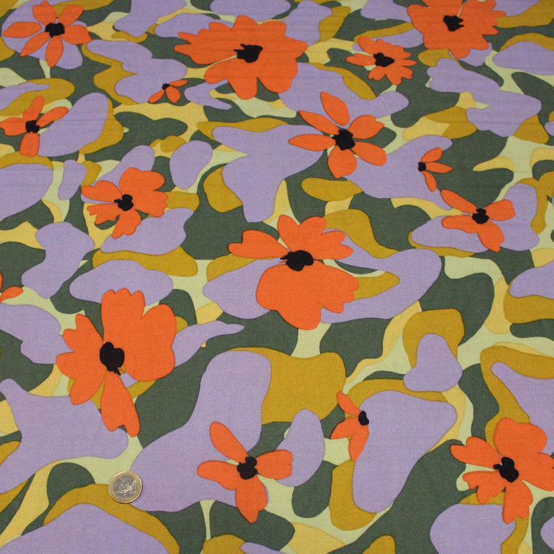 Tissu Viscose fluide AIMEE aux fleurs graphiques vertes, oranges et mauves - OEKO - TEX STANDARD 100 - tissuspipi.com