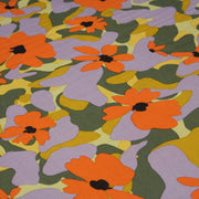 Tissu Viscose fluide AIMEE aux fleurs graphiques vertes, oranges et mauves - OEKO - TEX STANDARD 100 - tissuspipi.com