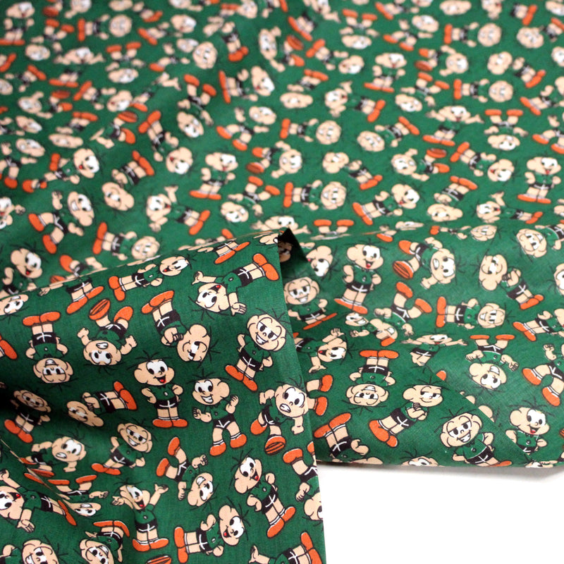 Tissu popeline coton vert au petit bonhomme, façon BD - tissuspipi.com
