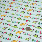 Tissu popeline coton DINO ROAR, bleu aux motifs dinosaures multicolores - tissuspipi.com