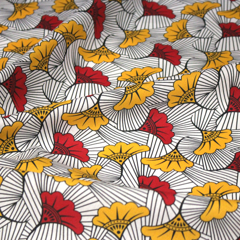 Tissu cotonnade motif WAX floral, fleurs rouges et jaunes - OEKO - TEX STANDARD 100 - tissuspipi.com