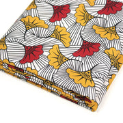 Tissu cotonnade motif WAX floral, fleurs rouges et jaunes - OEKO - TEX STANDARD 100 - tissuspipi.com