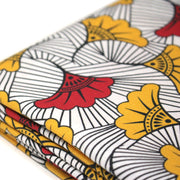 Tissu cotonnade motif WAX floral, fleurs rouges et jaunes - OEKO - TEX STANDARD 100 - tissuspipi.com