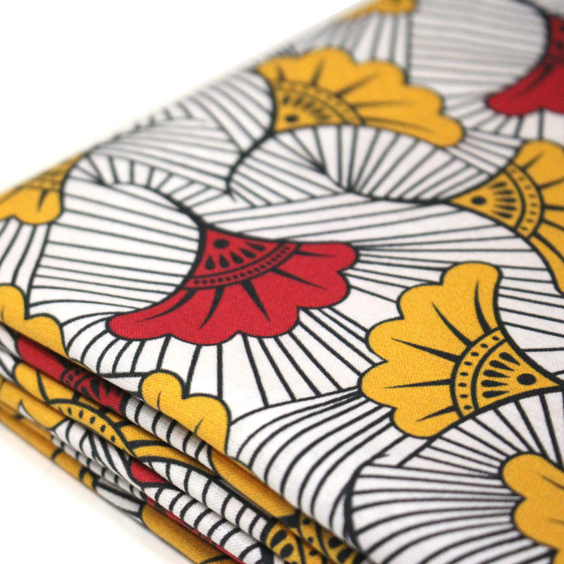 Tissu cotonnade motif WAX floral, fleurs rouges et jaunes - OEKO - TEX STANDARD 100 - tissuspipi.com