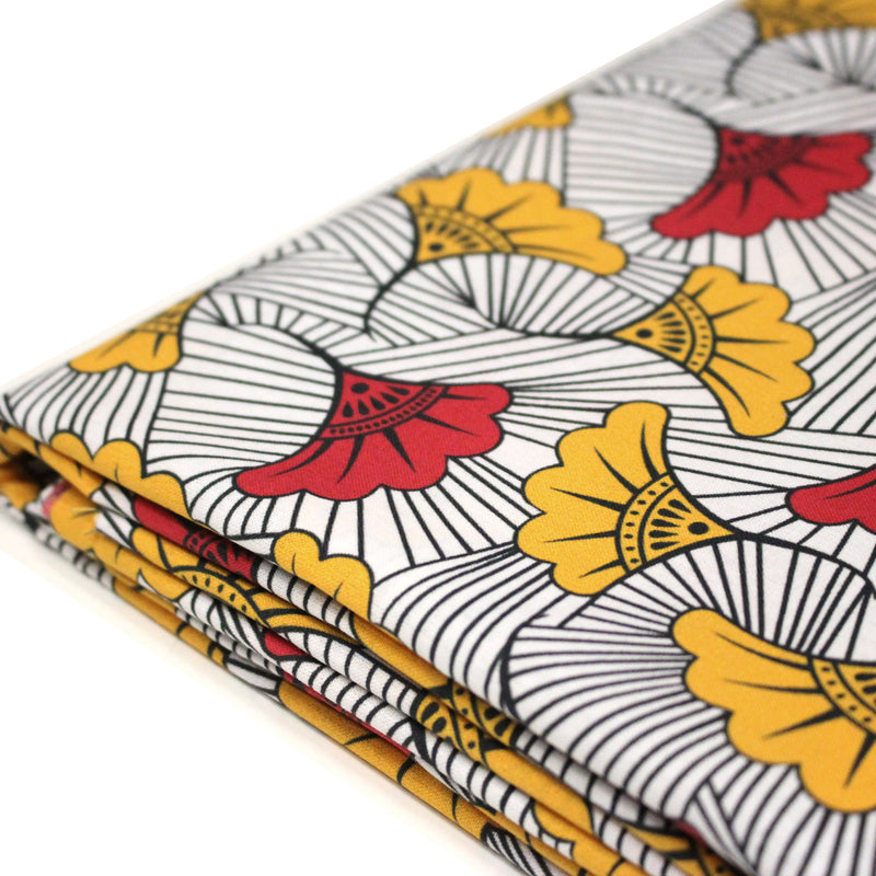 Tissu cotonnade motif WAX floral, fleurs rouges et jaunes - OEKO - TEX STANDARD 100 - tissuspipi.com