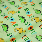 Tissu popeline coton DINO ROAR, vert aux motifs dinosaures multicolores - tissuspipi.com
