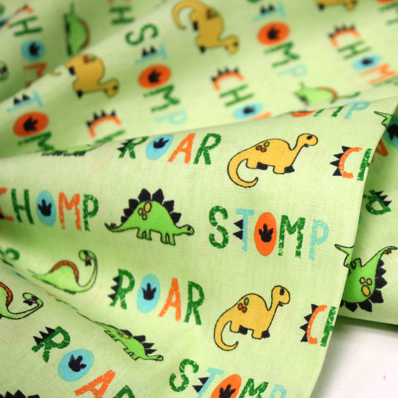 Tissu popeline coton DINO ROAR, vert aux motifs dinosaures multicolores - tissuspipi.com