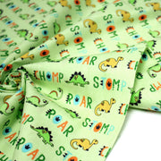 Tissu popeline coton DINO ROAR, vert aux motifs dinosaures multicolores - tissuspipi.com