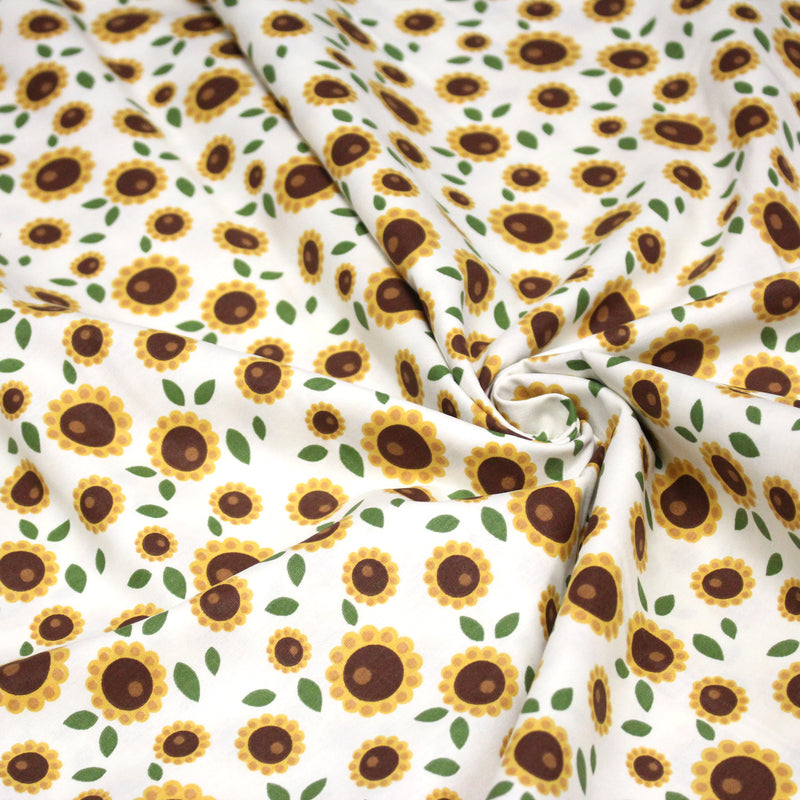 Tissu popeline coton blanc aux tournesols jaunes & feuilles vertes - tissuspipi.com