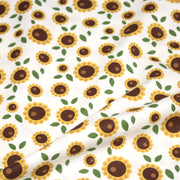 Tissu popeline coton blanc aux tournesols jaunes & feuilles vertes - tissuspipi.com