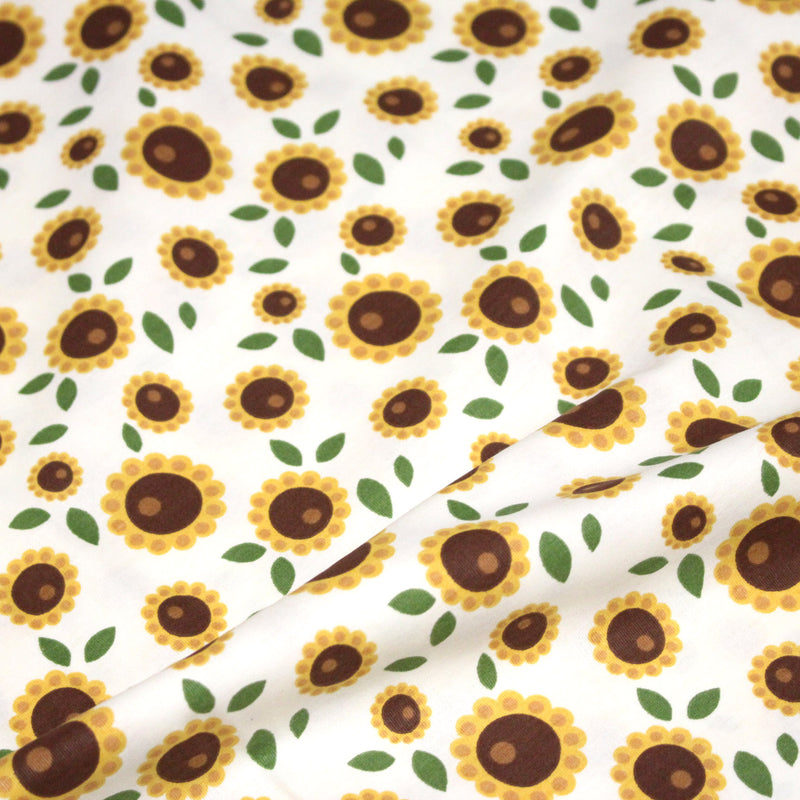 Tissu popeline coton blanc aux tournesols jaunes & feuilles vertes - tissuspipi.com