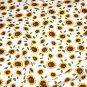 Tissu popeline coton blanc aux tournesols jaunes & feuilles vertes - tissuspipi.com