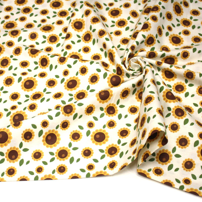Tissu popeline coton blanc aux tournesols jaunes & feuilles vertes - tissuspipi.com