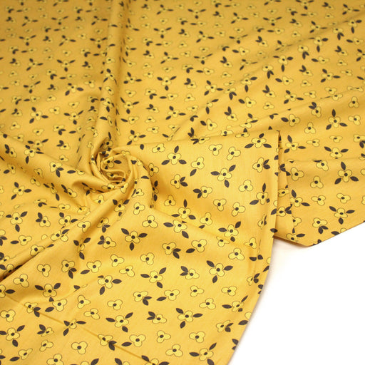 Tissu popeline coton jaune aux fleurs graphiques jaunes - tissuspipi.com
