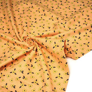 Tissu popeline coton corail aux fleurs graphiques jaunes - tissuspipi.com