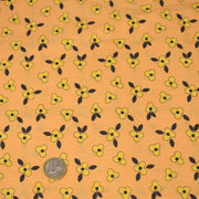 Tissu popeline coton corail aux fleurs graphiques jaunes - tissuspipi.com