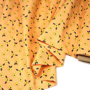Tissu popeline coton corail aux fleurs graphiques jaunes - tissuspipi.com