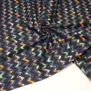 Tissu popeline coton zig zag bleu, noir et fines fleurs multicolores - tissuspipi.com