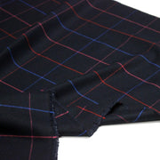 Tissu draperie lainage bleu nuit motif windowpane aux liserés roses rouges et bleu roi - tissuspipi.com