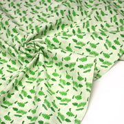 Tissu popeline coton écru aux fougères et feuilles tropicales vertes - tissuspipi.com