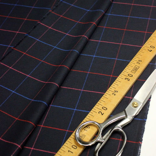 Tissu draperie lainage bleu nuit motif windowpane aux liserés roses rouges et bleu roi - tissuspipi.com
