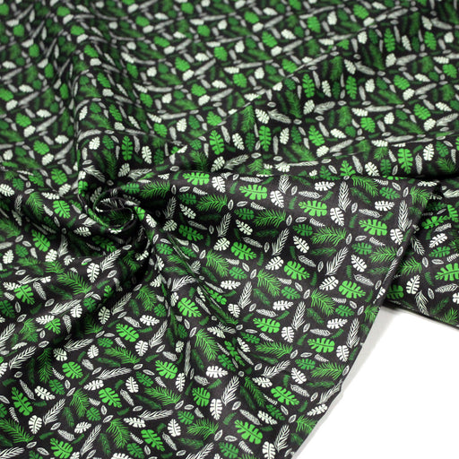 Tissu popeline coton noir aux fougères et feuilles tropicales vertes - tissuspipi.com