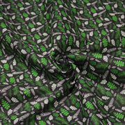 Tissu popeline coton noir aux fougères et feuilles tropicales vertes - tissuspipi.com