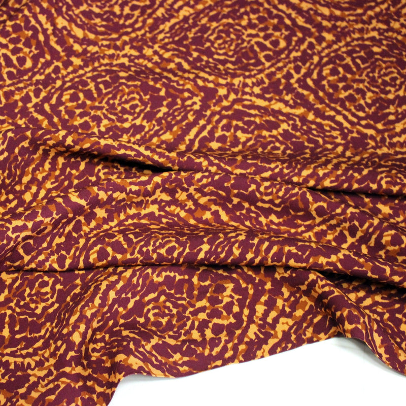 Tissu Viscose fluide ASSA arabesques rouge bordeaux fond ocre – STANDARD 100 OEKO - TEX - tissuspipi.com