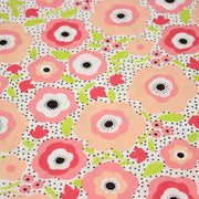 Tissu cotonnade aux belles fleurs roses graphiques sur fond blanc pois noirs - COLLECTION ÉTÉ - tissuspipi.com