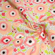 Tissu cotonnade aux belles fleurs roses graphiques sur fond blanc pois noirs - COLLECTION ÉTÉ - tissuspipi.com