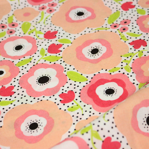 Tissu cotonnade aux belles fleurs roses graphiques sur fond blanc pois noirs - COLLECTION ÉTÉ - tissuspipi.com