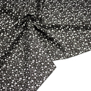 Tissu cotonnade noir aux fleurs blanches - OEKO - TEX - tissuspipi.com