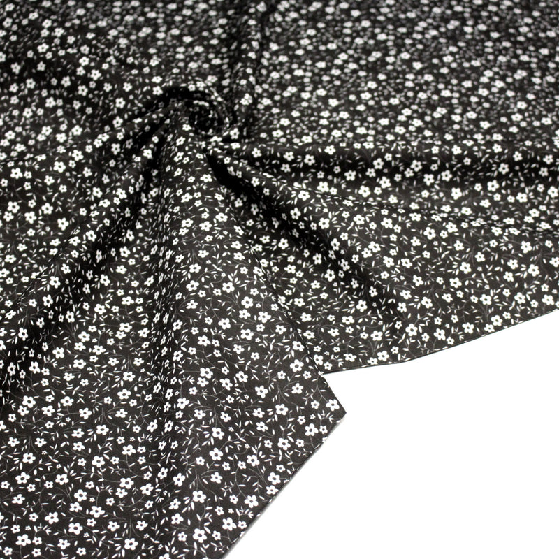 Tissu cotonnade noir aux fleurs blanches - OEKO - TEX - tissuspipi.com