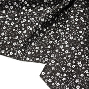 Tissu cotonnade noir aux fleurs blanches - OEKO - TEX - tissuspipi.com