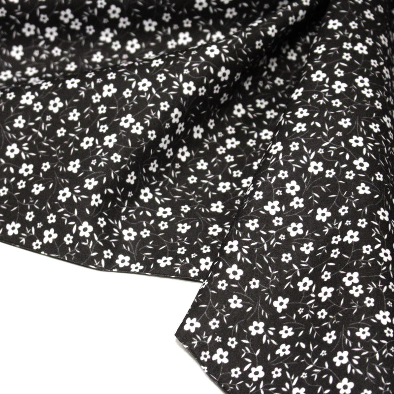 Tissu cotonnade noir aux fleurs blanches - OEKO - TEX - tissuspipi.com