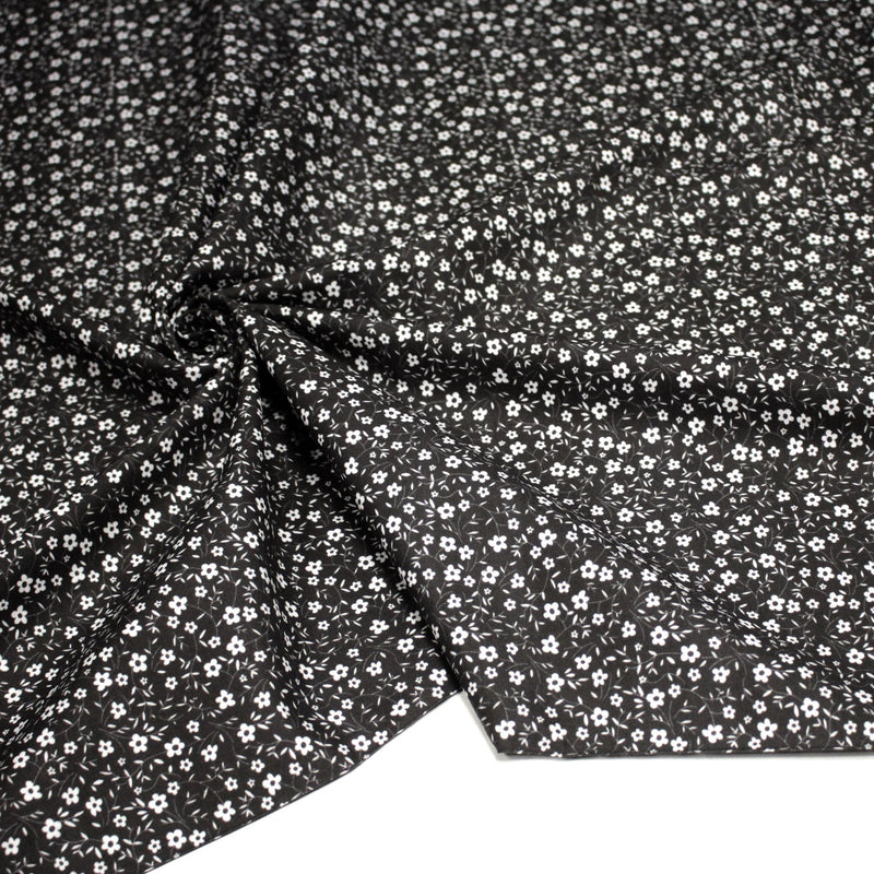 Tissu cotonnade noir aux fleurs blanches - OEKO - TEX - tissuspipi.com