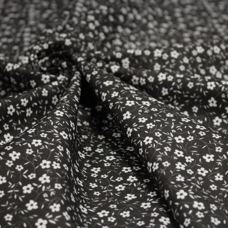 Tissu cotonnade noir aux fleurs blanches - OEKO - TEX - tissuspipi.com