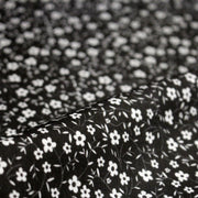 Tissu cotonnade noir aux fleurs blanches - OEKO - TEX - tissuspipi.com