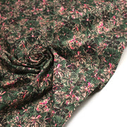 Tissu cotonnade ESTORIL fleuri vert aux touches noires, fuchsia et écrues - STANDARD 100 OEKO - TEX - tissuspipi.com