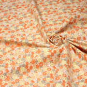 Tissu popeline coton fleurie orange jaune vert fond orange - OEKO - TEX - tissuspipi.com