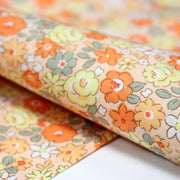 Tissu popeline coton fleurie orange jaune vert fond orange - OEKO - TEX - tissuspipi.com