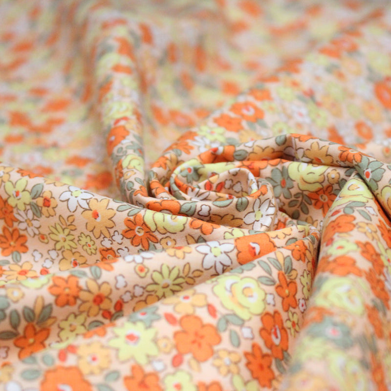 Tissu popeline coton fleurie orange jaune vert fond orange - OEKO - TEX - tissuspipi.com