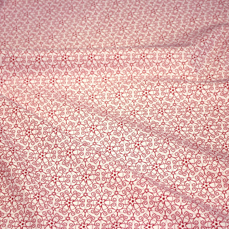 Tissu de Noël cotonnade blanc aux motifs géométriques rouges de Noël - tissuspipi.com