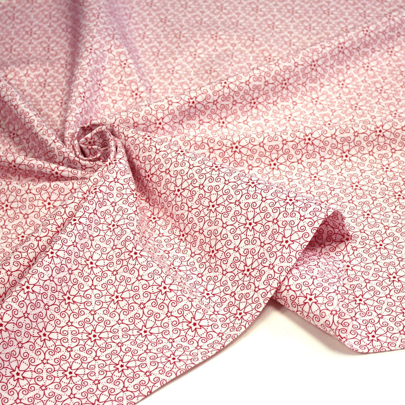 Tissu de Noël cotonnade blanc aux motifs géométriques rouges de Noël - tissuspipi.com
