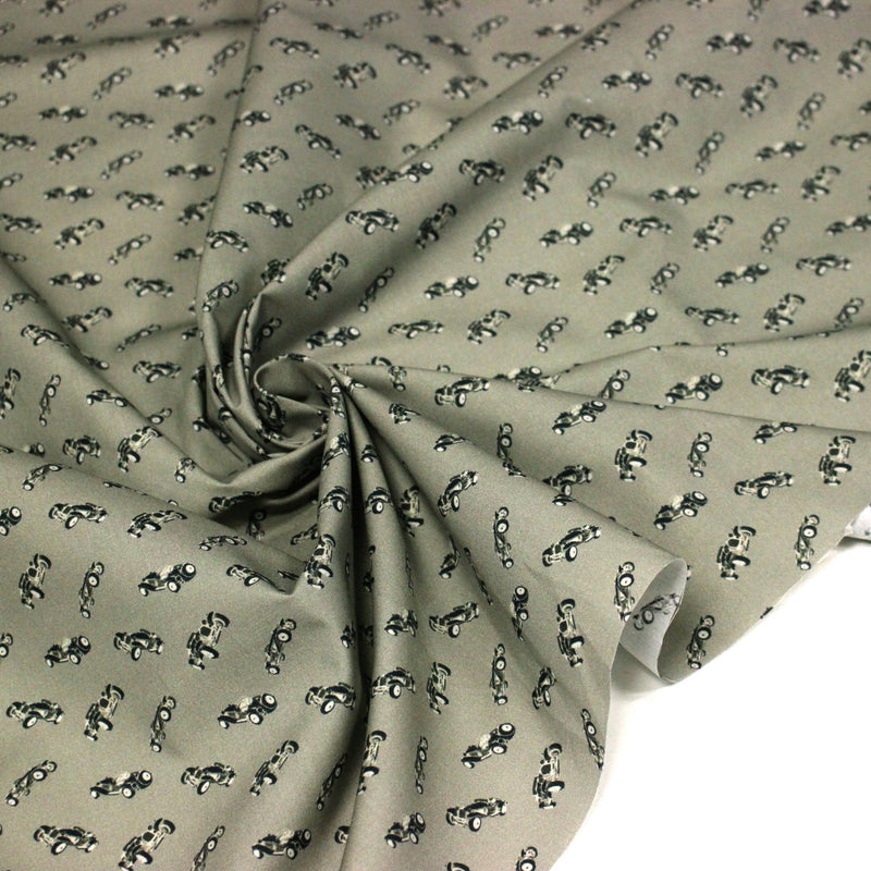 Tissu popeline coton aux petites voitures ancienne, fond vert kaki - tissuspipi.com