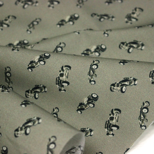 Tissu popeline coton aux petites voitures ancienne, fond vert kaki - tissuspipi.com